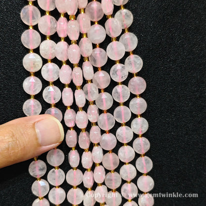 Close up view showcasing bead alignment and stringing holes of rose quartz star beads