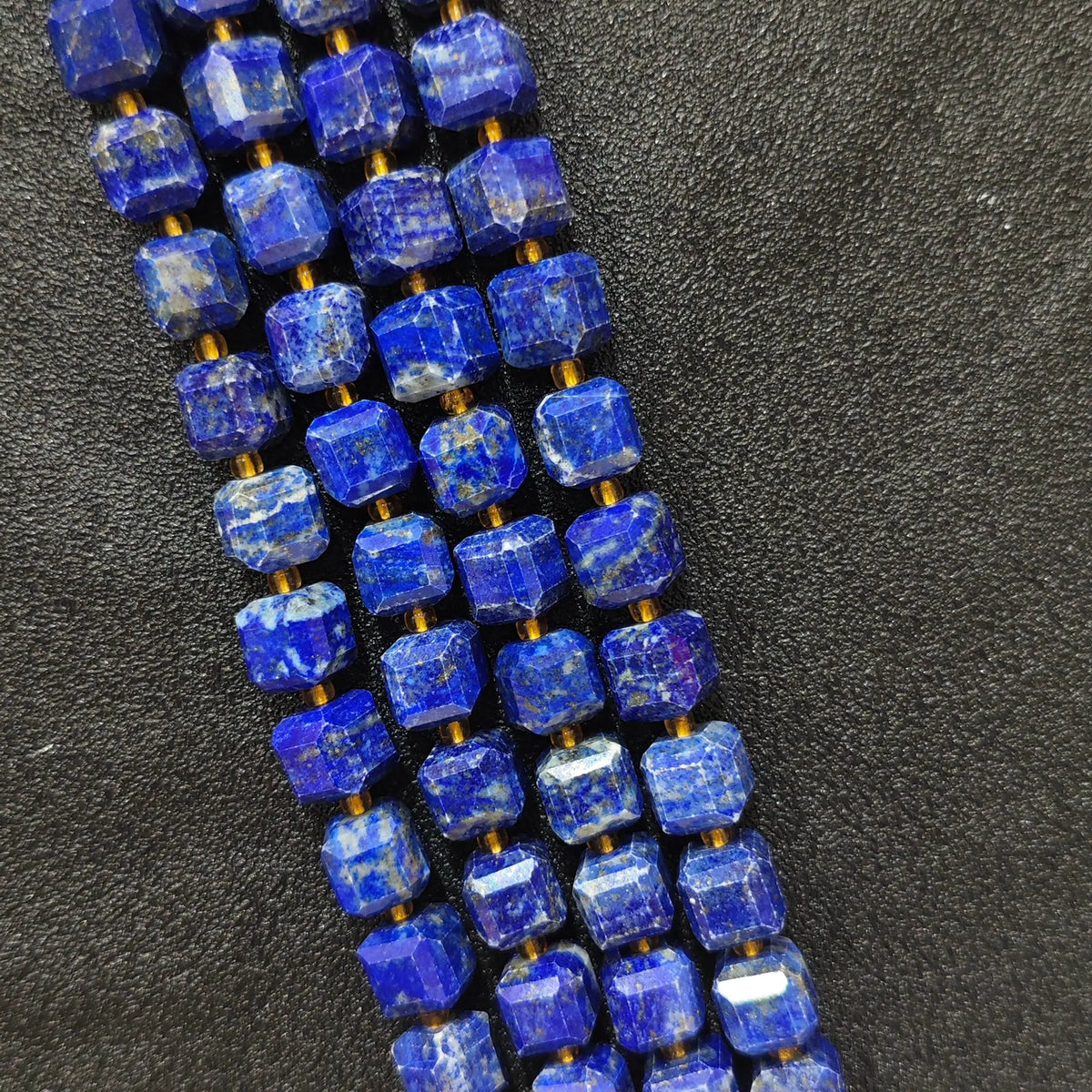 Full strands of natural lapis lazuli square block beads featuring golden pyrite flecks for wholesale buyers