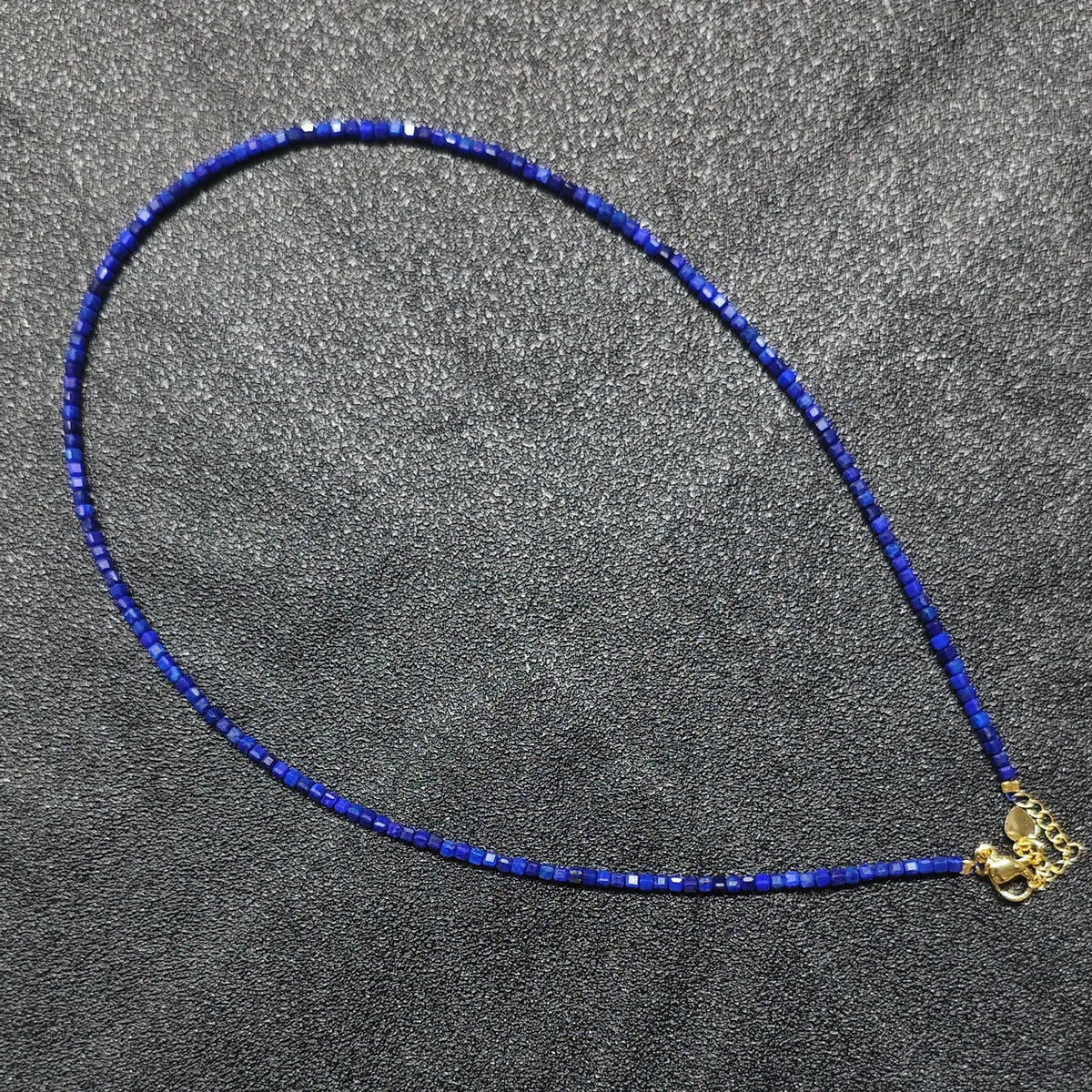 Royal Lapis Lazuli gemstone collar necklace featuring 2.5mm square cube beads and gold extension chain