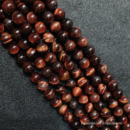 Earthy red tiger eye loose round beads strands with prominent internal fracture lines for rustic jewelry