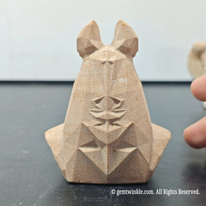 back profile of natural sandstone anubis bust sculpture displaying carved scarab beetle emblem