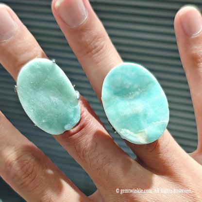 seafoam blue aragonite gemstone statement rings displaying smooth organic stone surface