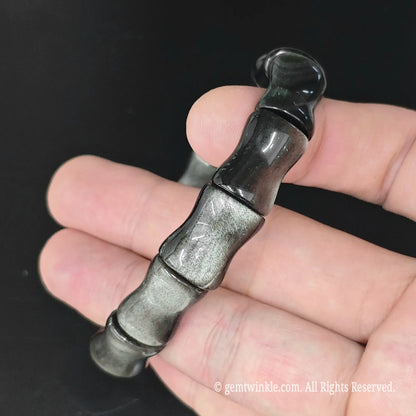 Vertical view of silver sheen obsidian bamboo joint bead stretch bracelet showing uniform segment alignment