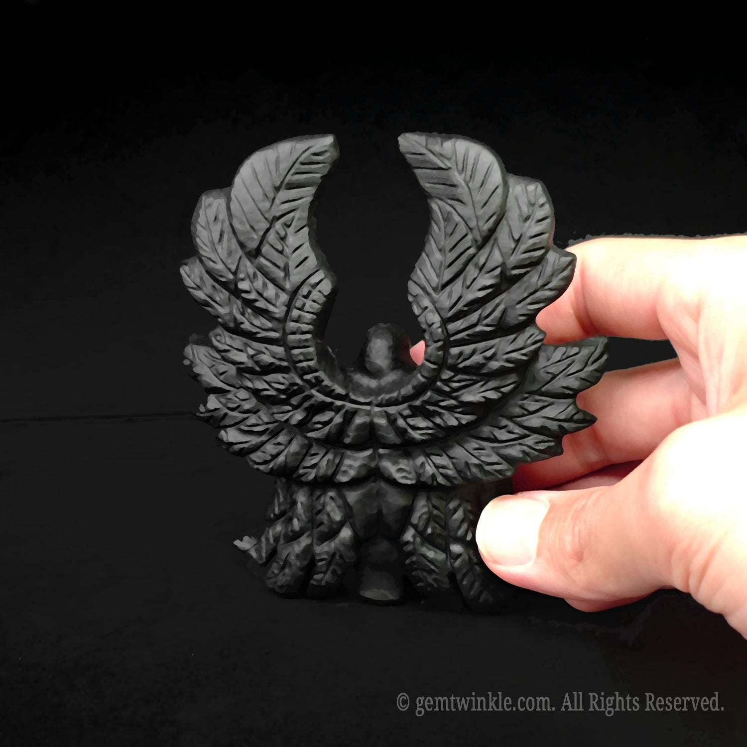 Intricate layered wing details on the back of the hand sculpted black obsidian six winged angel figurine