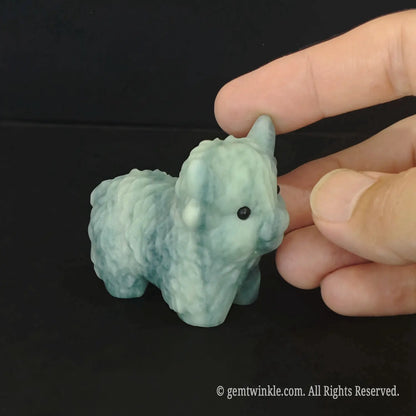 Carved sky blue natural stone lamb figurine with detailed textured wool curly coat