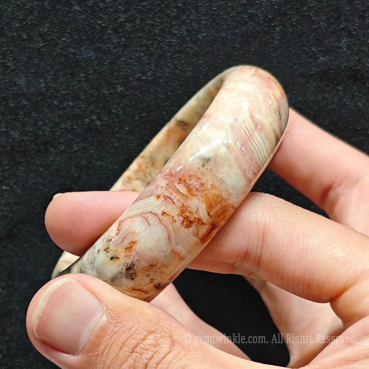close up of smooth rounded surface and natural gloss of agate bracelet