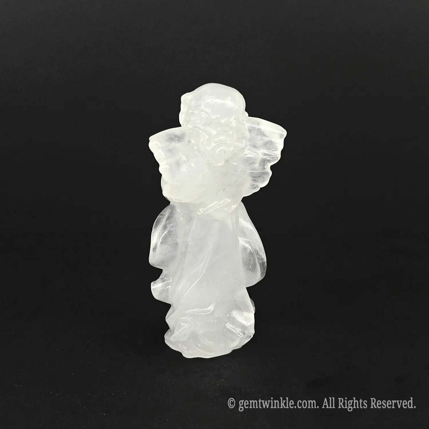 Back view of a natural snow quartz praying angel carving with finely detailed wings, highly popular as crystal housewarming gifts