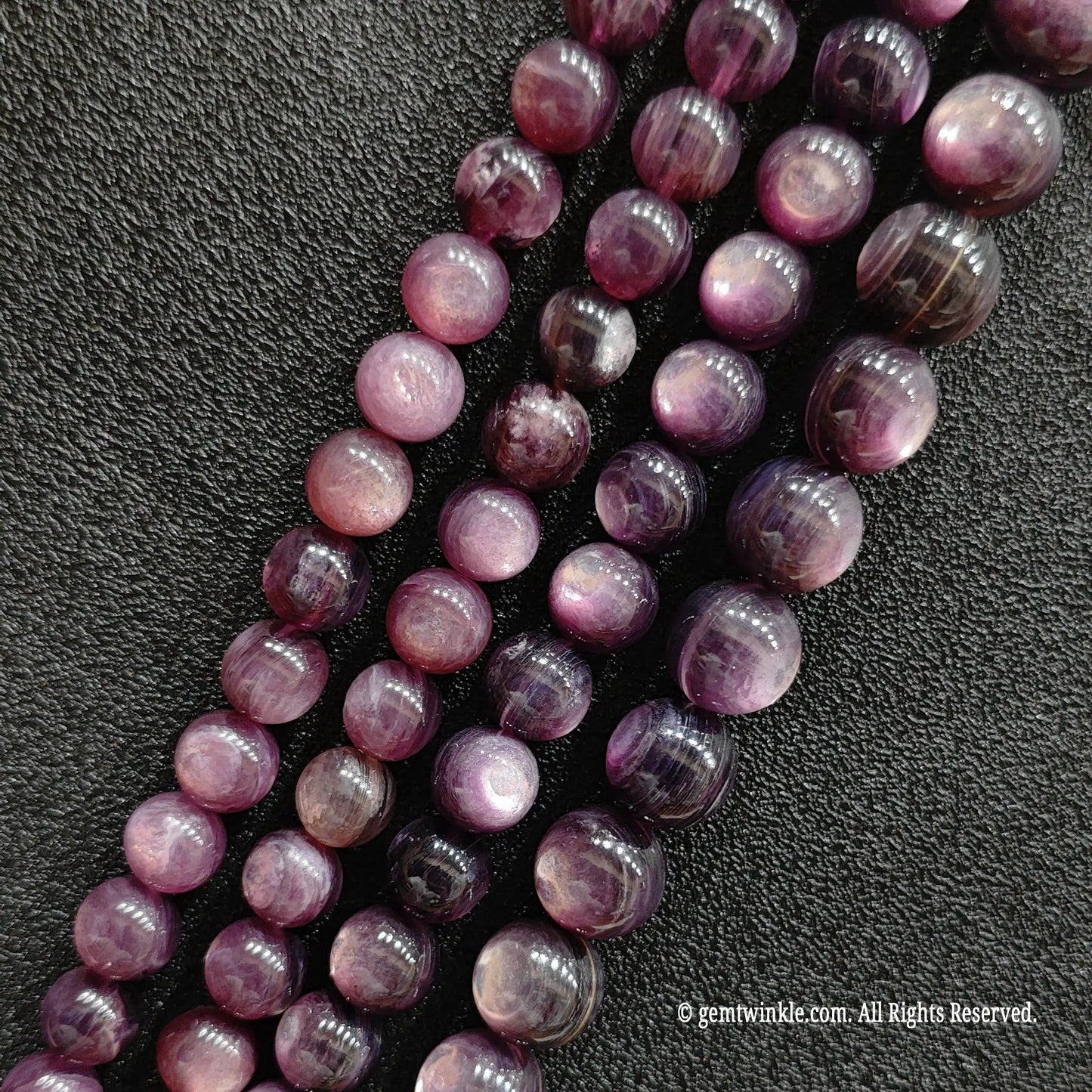 Close up of stabilized purple lepidolite crystal beads highlighting the unique glittering mica sheets from image_11359b.jpg