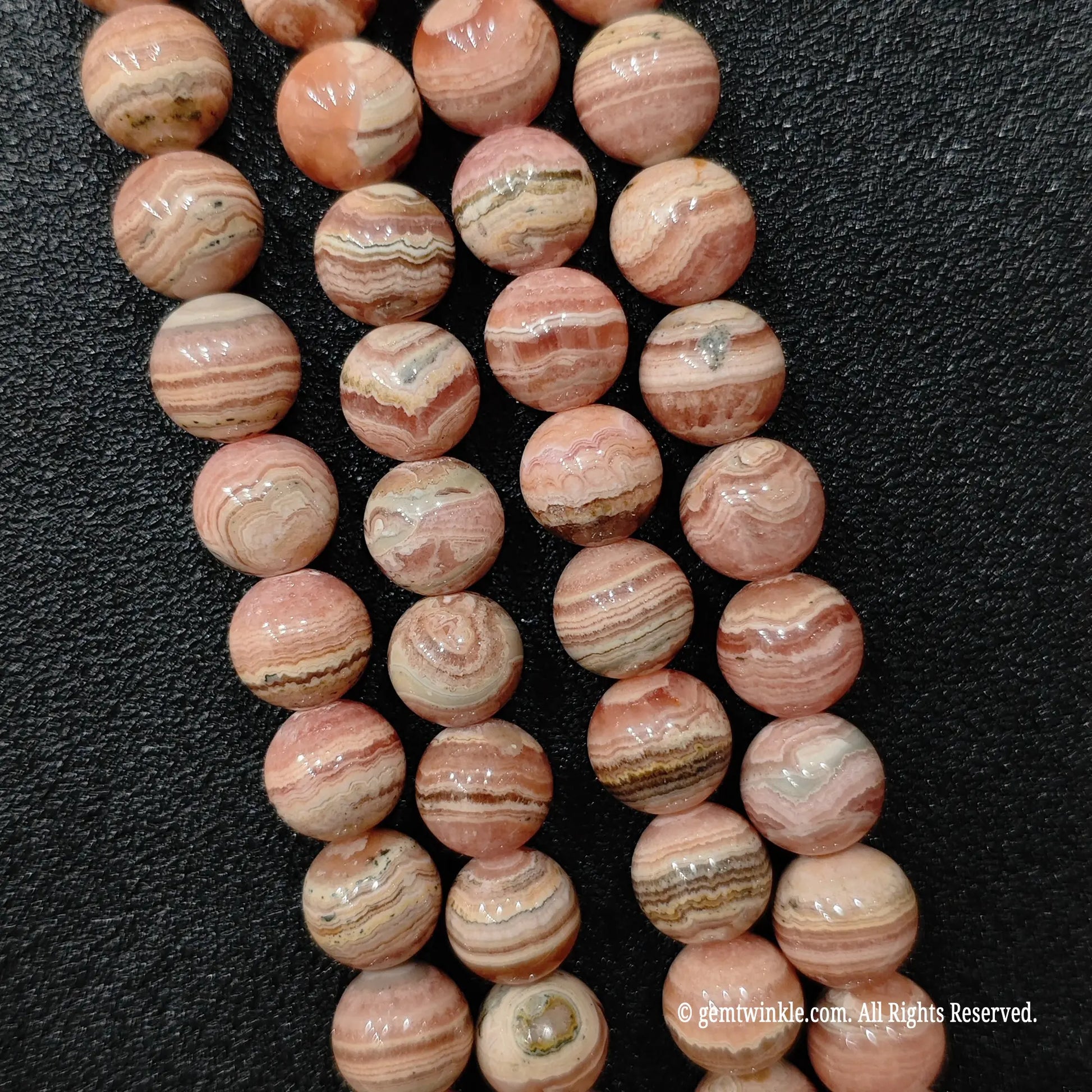 Resin stabilized natural rhodochrosite round mineral bead strands from donghai crystal wholesale market stock