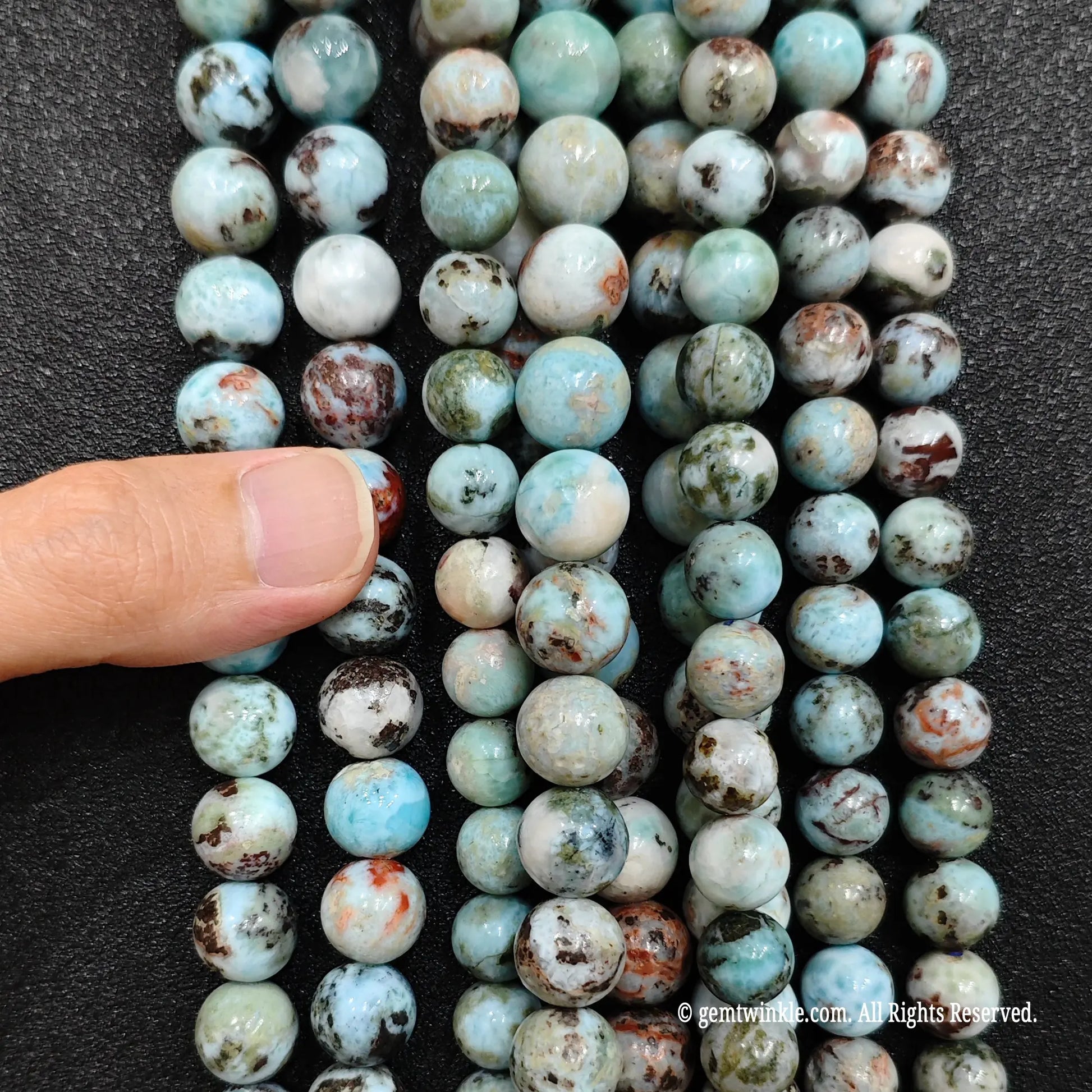 Resin stabilized natural larimar loose crystal bead strands close up display for small shops