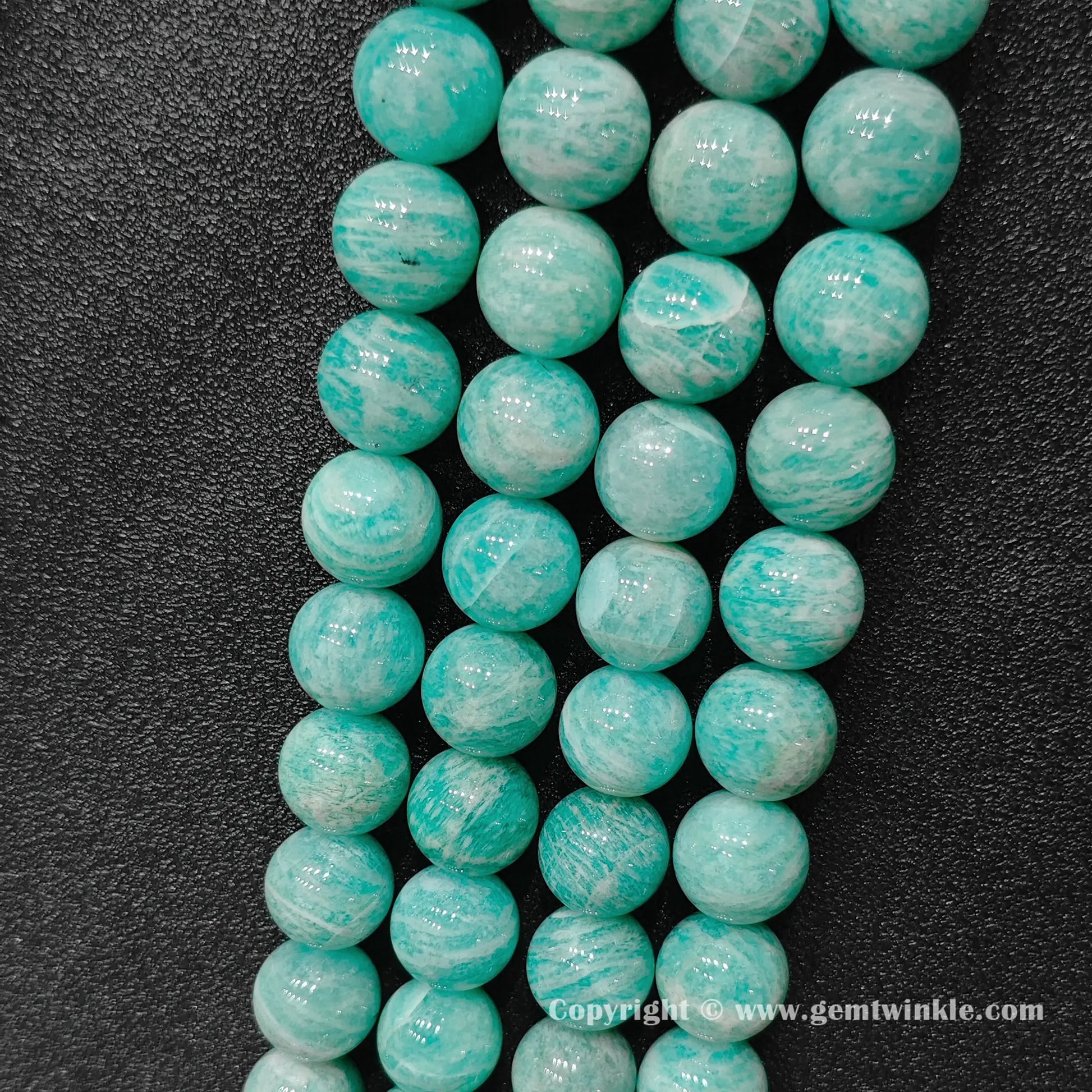 Vertical view of natural Grade B amazonite statement gemstone bead strands showing seafoam green tones