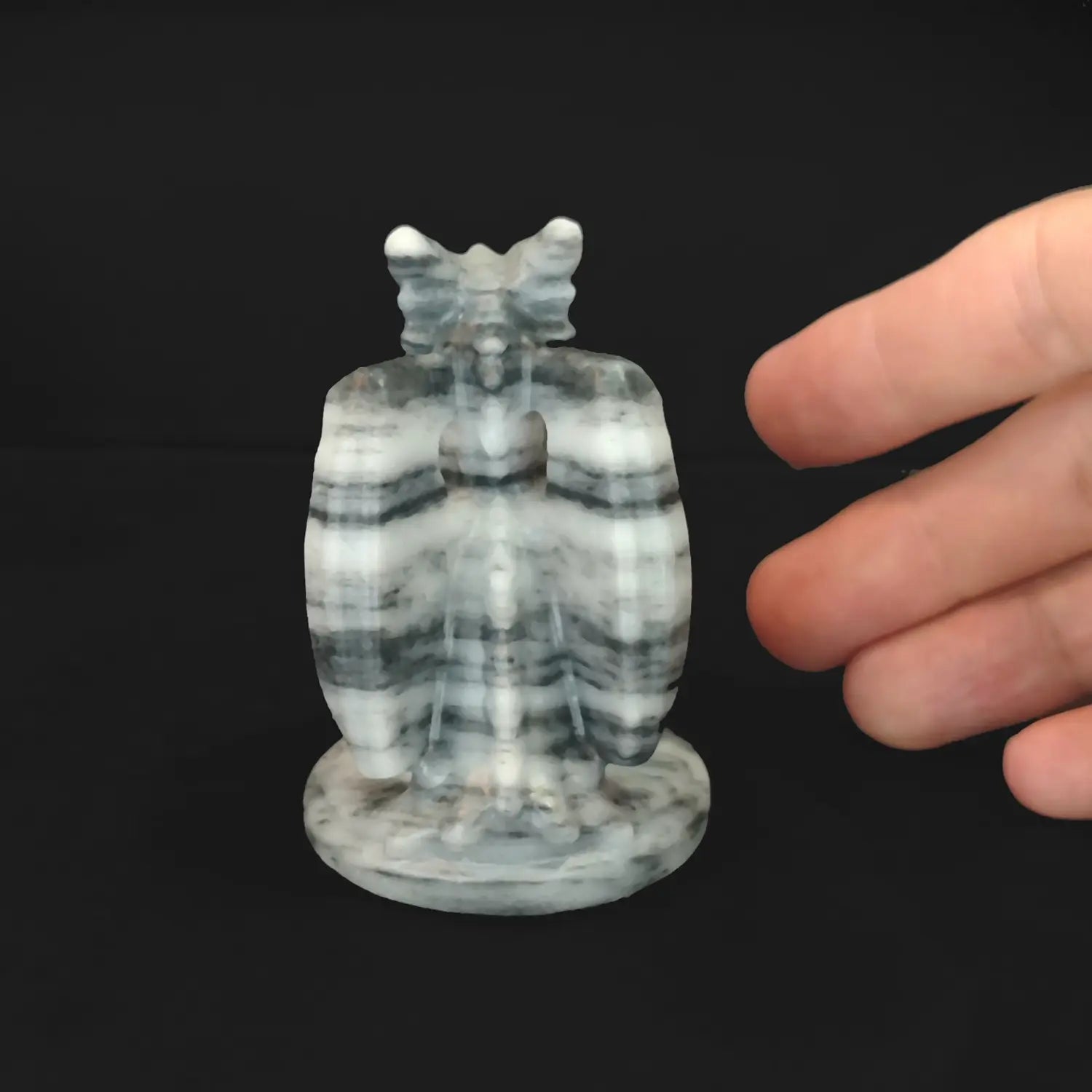 Back view of striped stone dragon carving