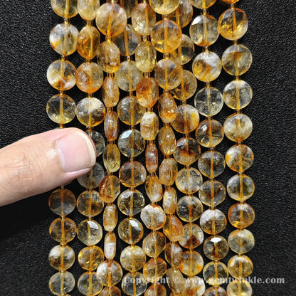 Full strand of 10mm thermally enhanced citrine flat disc beads containing approx 30 pcs