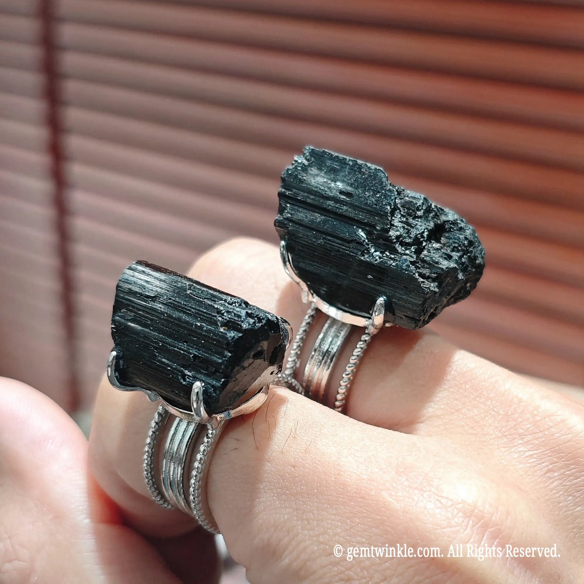 Full view of a thoughtful gift raw crystal specimen ring on hand displaying intense jet black mineral color