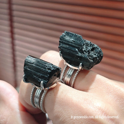 Full view of a thoughtful gift raw crystal specimen ring on hand displaying intense jet black mineral color