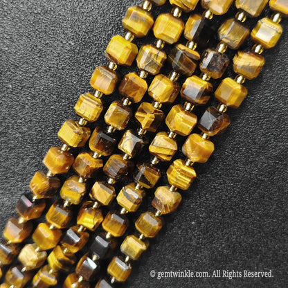 Macro close-up showing the golden brown optical shimmer and fibrous details of tiger eye blocks