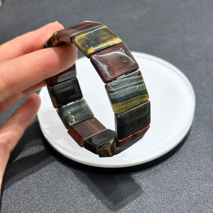 Pair of Natural Multicolor Tiger Eye Rectangular Bead Bangles displayed on white plate, product photography