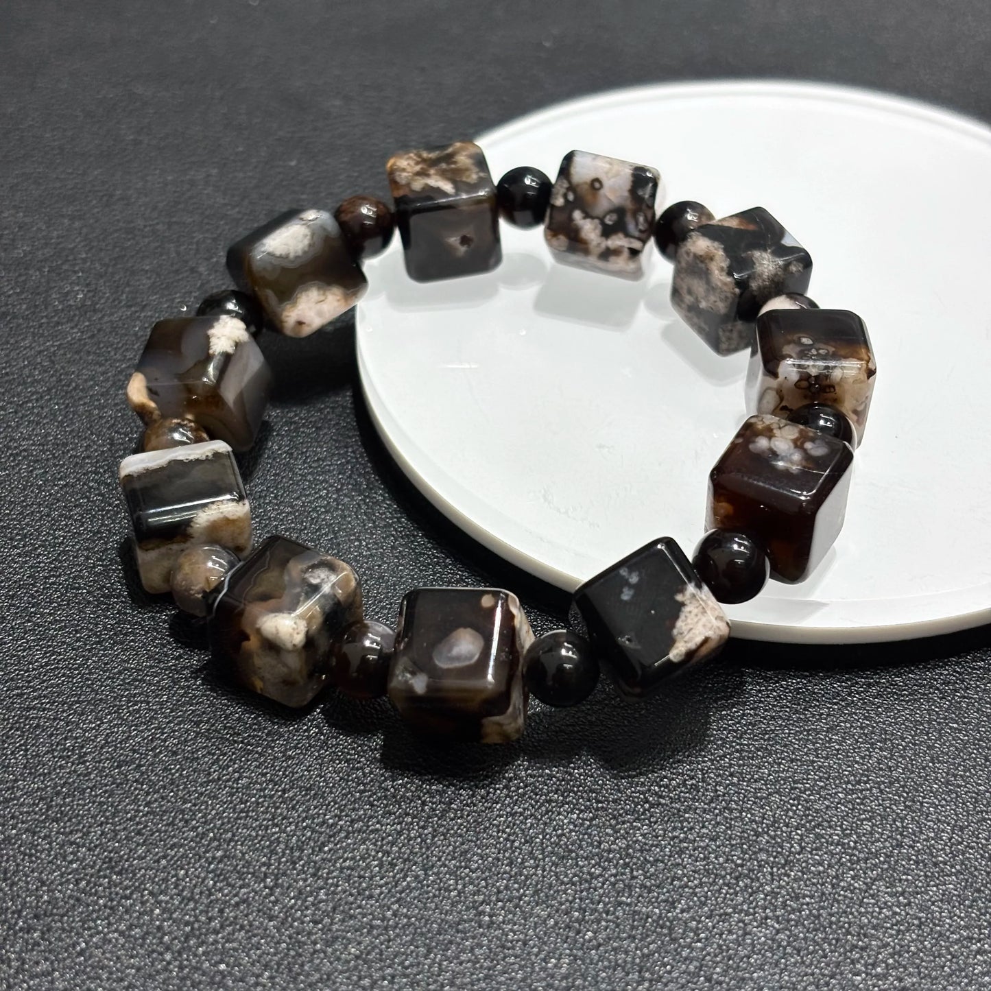 Top view of Black Sakura Agate bangle bracelet, square cube beads, elastic stretch fit.