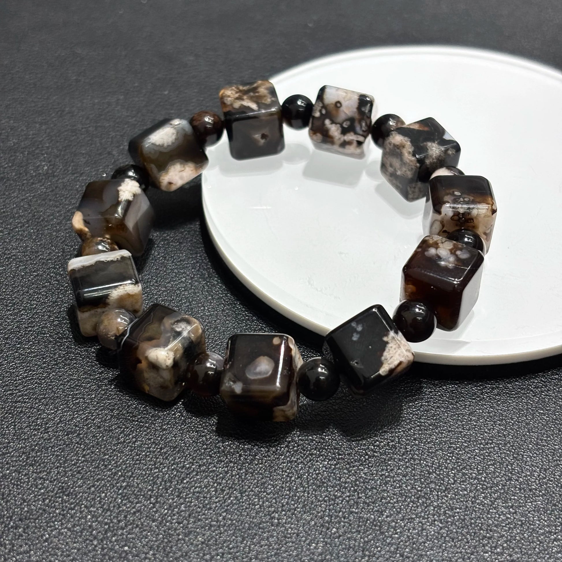 Top view of Black Sakura Agate bangle bracelet, square cube beads, elastic stretch fit.