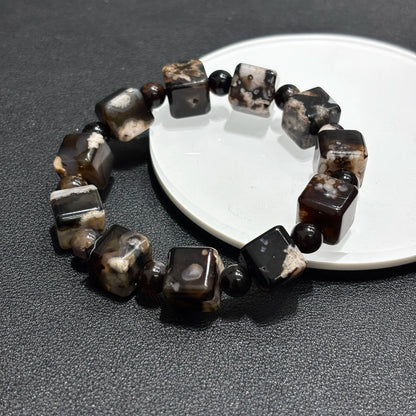 Top view of Black Sakura Agate bangle bracelet, square cube beads, elastic stretch fit.
