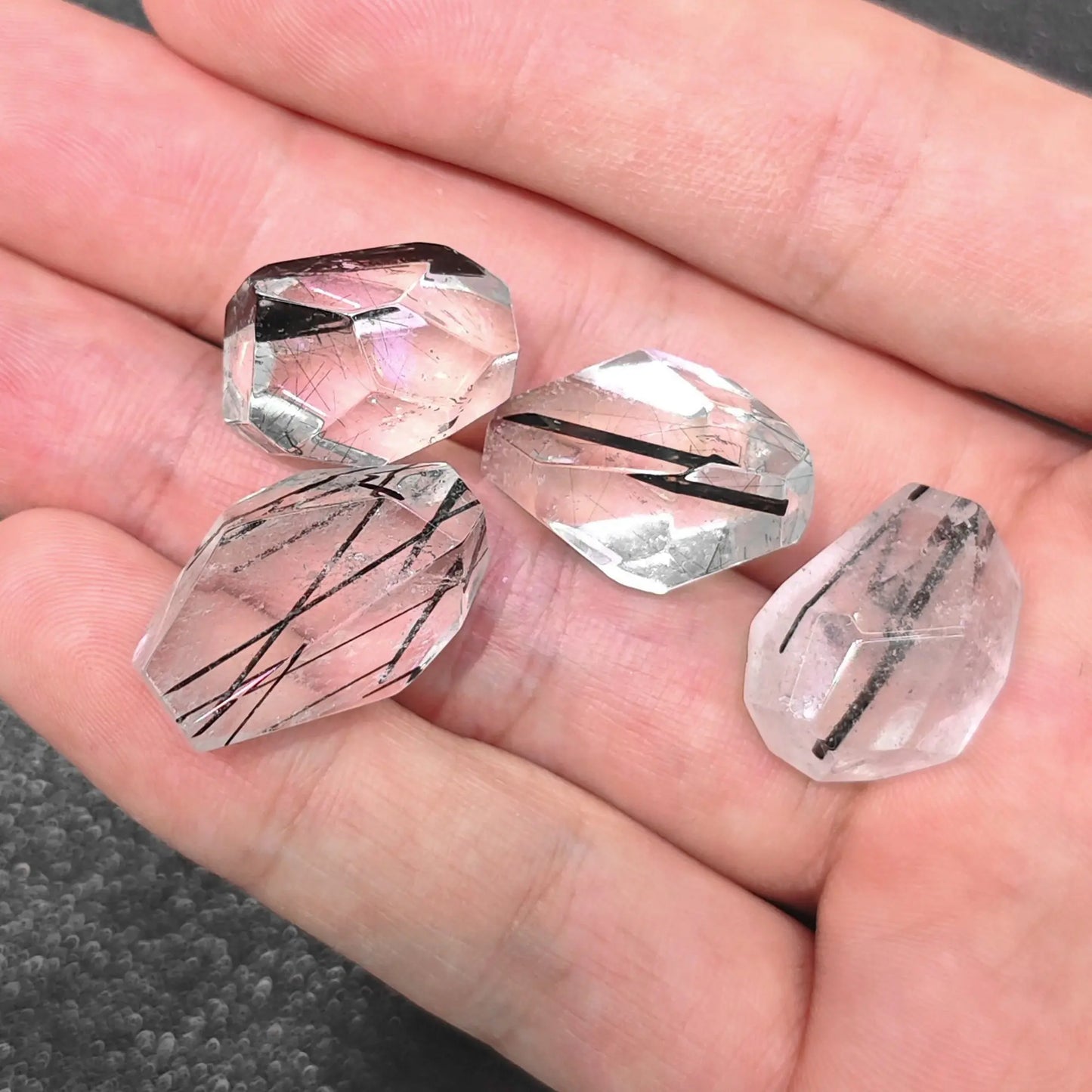close up of pair 20mm tourmaline quartz freeform beads showing black needle inclusions