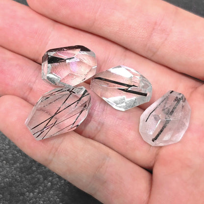 close up of pair 20mm tourmaline quartz freeform beads showing black needle inclusions