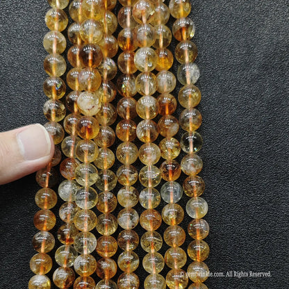 Parallel vertical alignment of premium translucent golden tower quartz crystal strands indicating superior light refraction