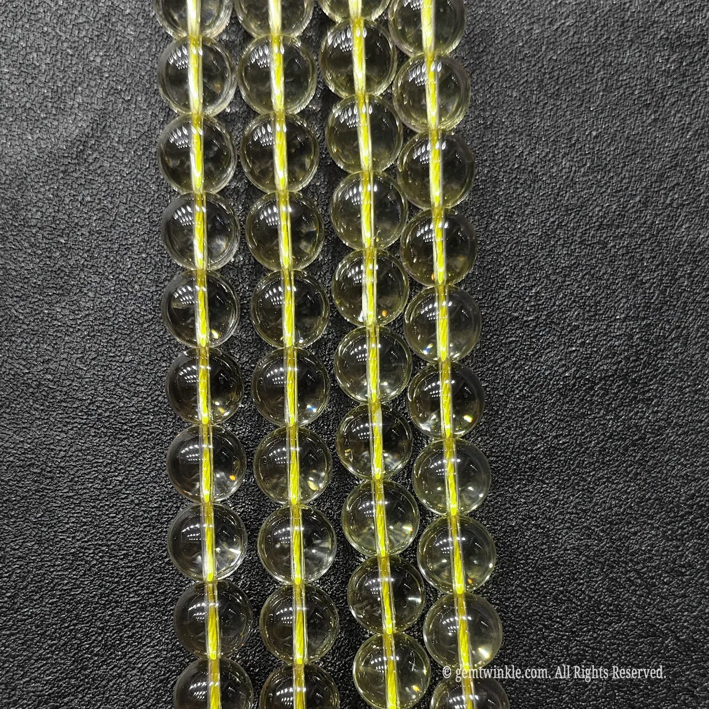A grade transparent light yellow quartz gemstone beads 12mm showing premium ice clear crystal structure