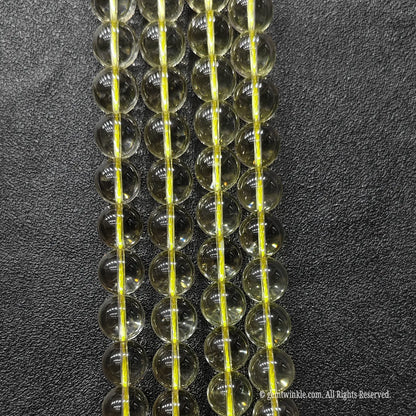 A grade transparent light yellow quartz gemstone beads 12mm showing premium ice clear crystal structure