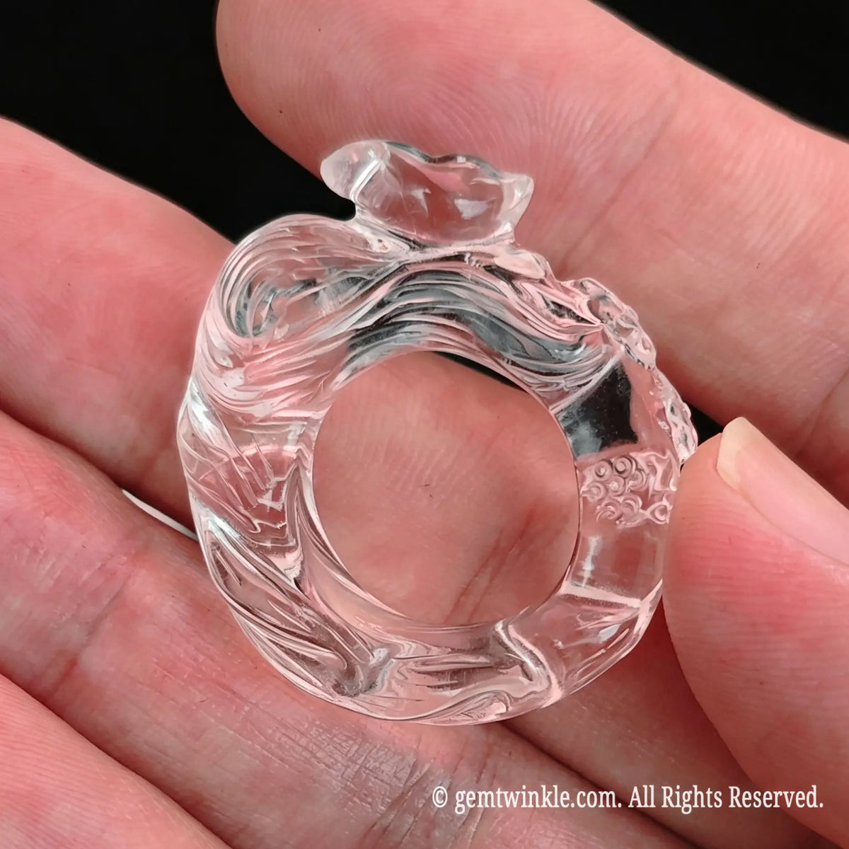 Side view preview of clear quartz fox ring highlighting smooth inner band and carved crystal details