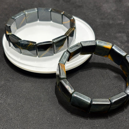 Two Natural Blue & Yellow Tiger Eye Faceted Rectangle Bangle Bracelets on White Plate