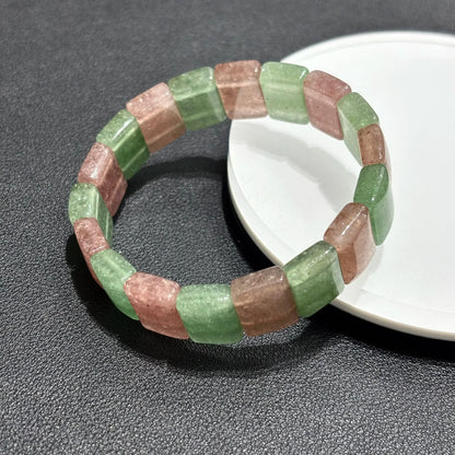 Two Natural Pink & Green Strawberry Quartz Bangle Bracelets arranged on a white plate, showcasing the elastic stretch and bead alignment.