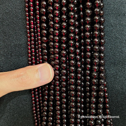 detailed macro shot of authentic deep red garnet gemstone beads