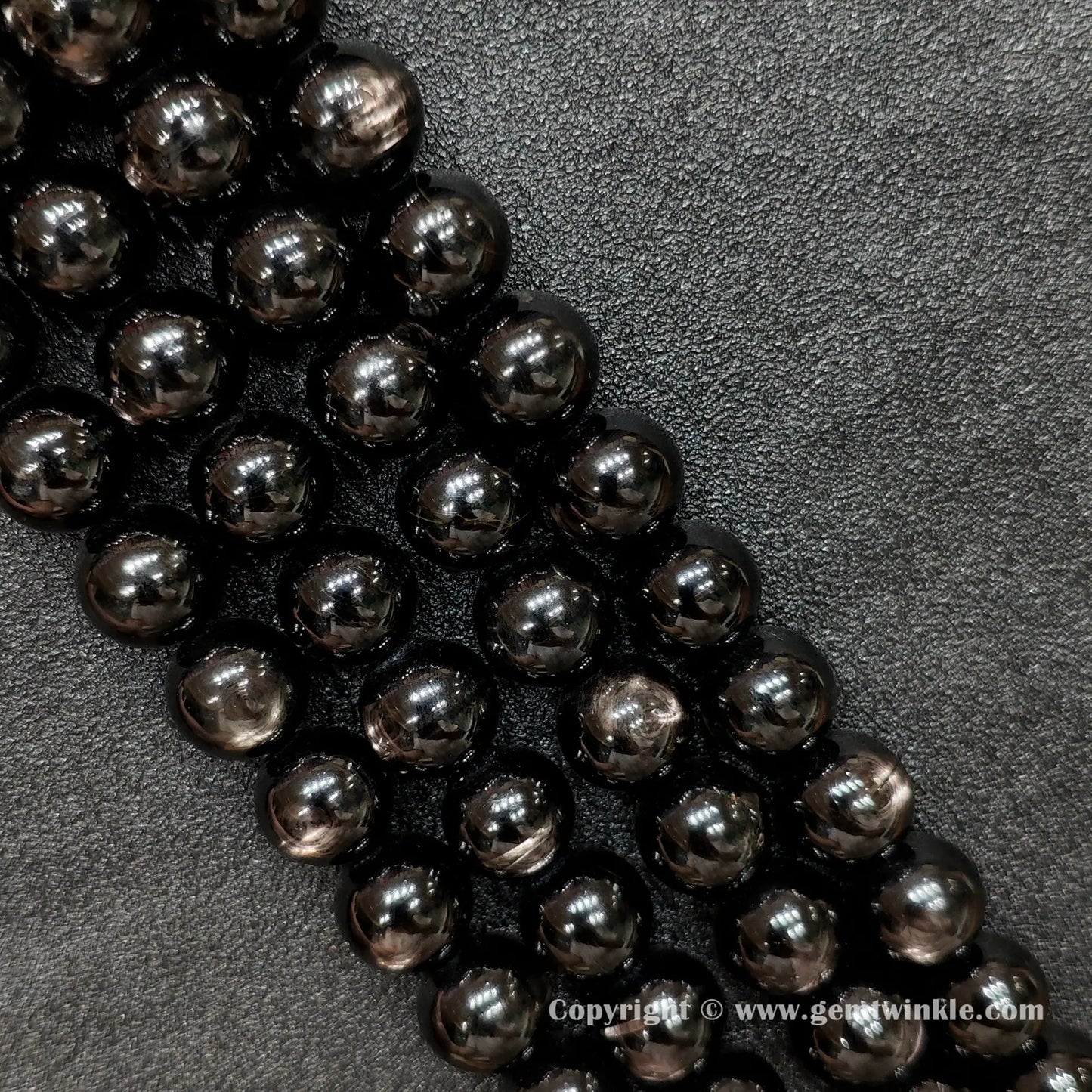 Four strands of un-dyed genuine B grade hypersthene gemstone beads displaying natural metallic sheen and rich black mineral textures from factory supplier