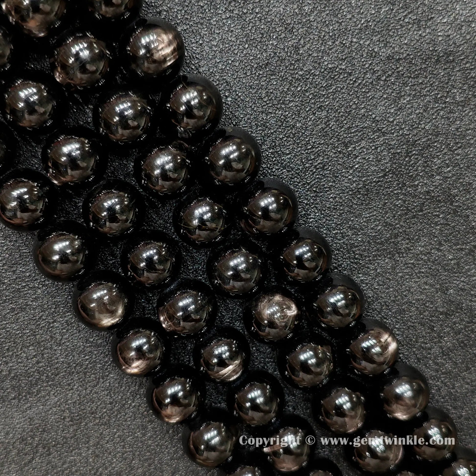 Four strands of un-dyed genuine B grade hypersthene gemstone beads displaying natural metallic sheen and rich black mineral textures from factory supplier