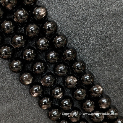 Four strands of un-dyed genuine B grade hypersthene gemstone beads displaying natural metallic sheen and rich black mineral textures from factory supplier