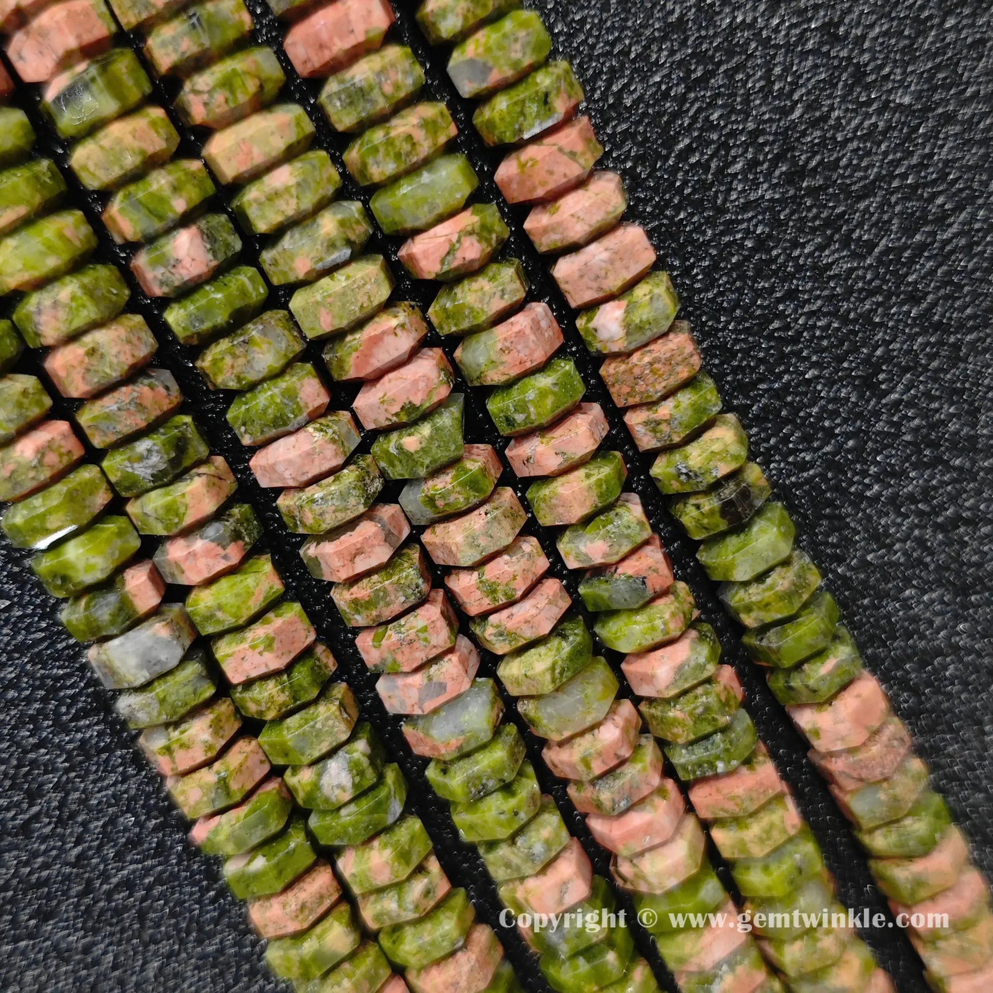 Multiple strands of natural unakite faceted disc rondelle beads laid together for bulk preview