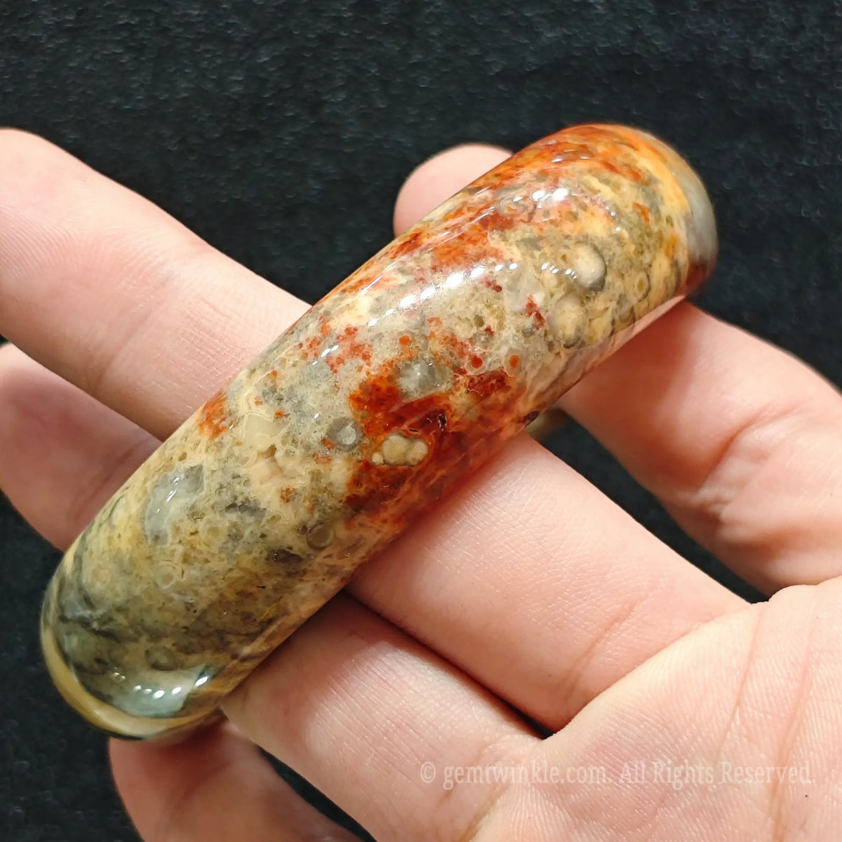 smooth outer curvature and natural glossy surface of exact red speckled agate bracelet
