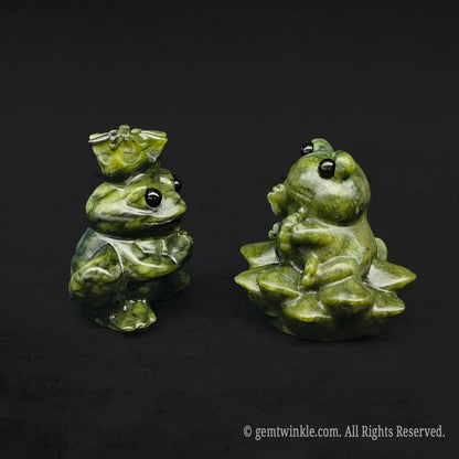 Side view of a whimsical serpentine stone frog royalty couple carving displaying the detailed multi layered lotus base and royal crown