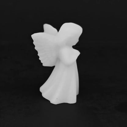 Front side view of a hand carved white marble guardian angel statue displaying soft matte finish and detailed wings