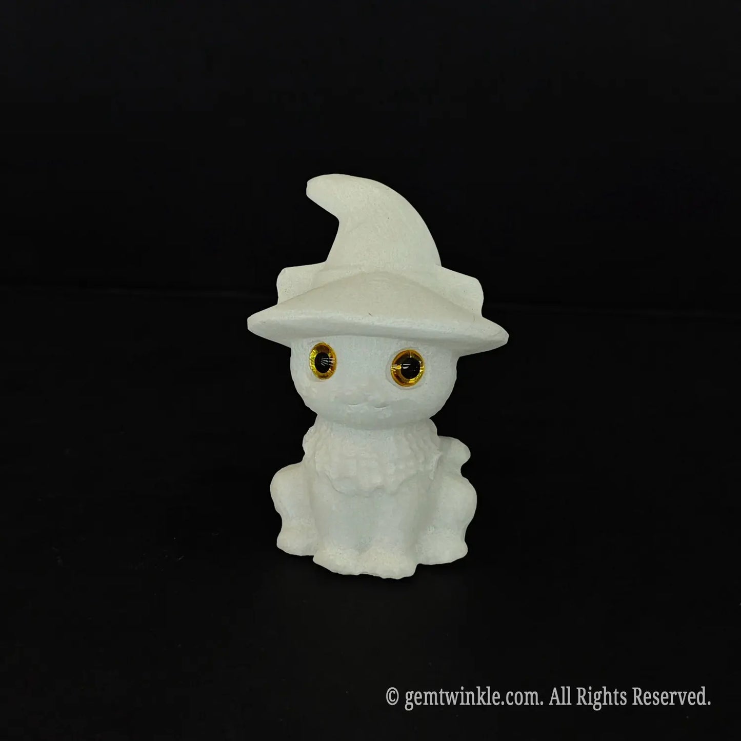 A standalone front view of a white marble witch cat sculpture highlighting the detailed ruffle collar and glossy golden eyes