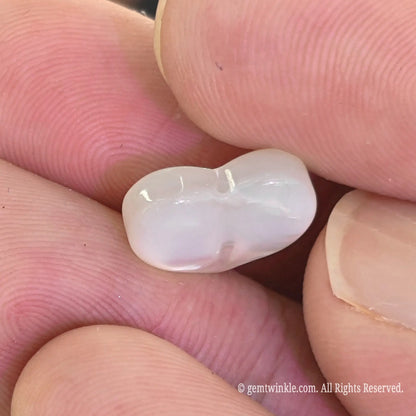 White lip shell heart focal bead side profile showing smooth 3d puffy contours and natural shell thickness