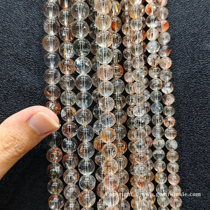Bulk warehouse loose strands of real B plus grade copper rutilated quartz round beads perfect for substantial handmade jewelry and energy bracelets