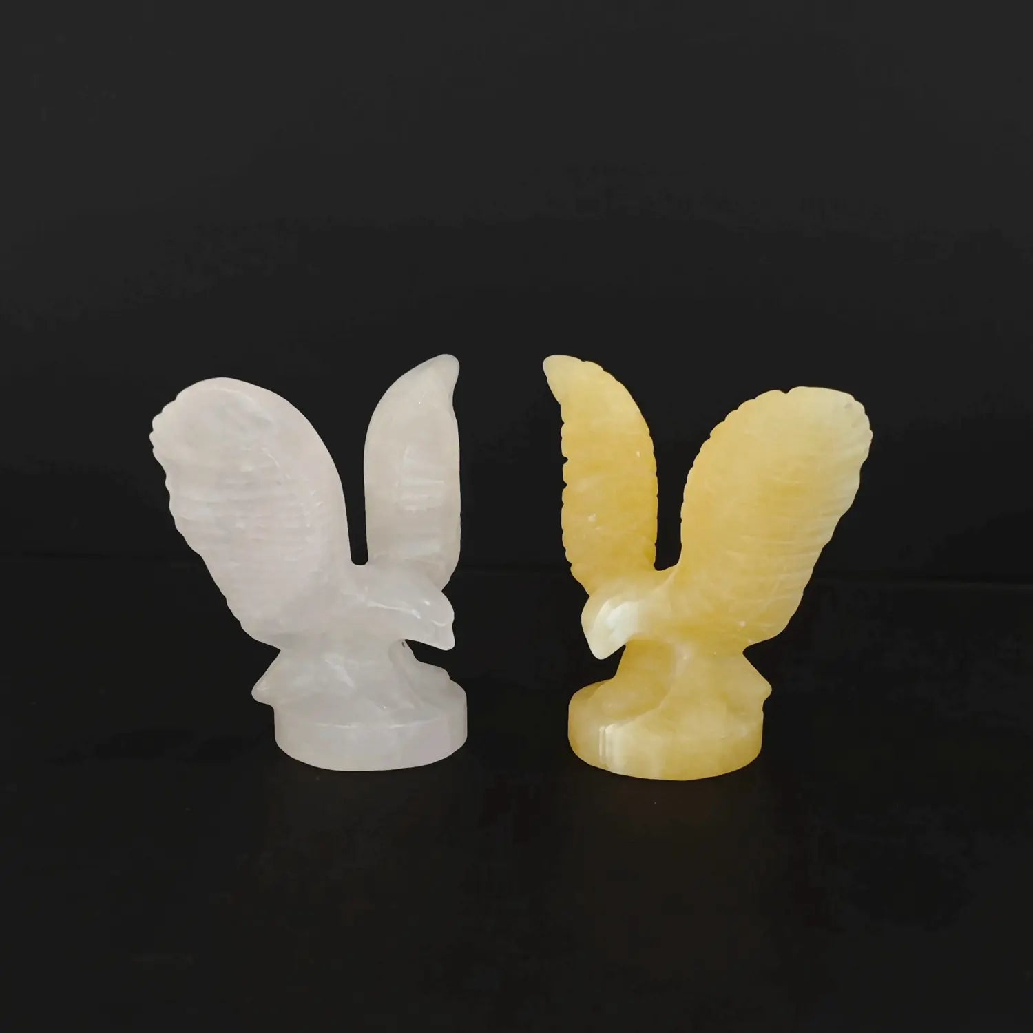 Wholesale natural crystal eagle statues carved from rose quartz and yellow calcite stones