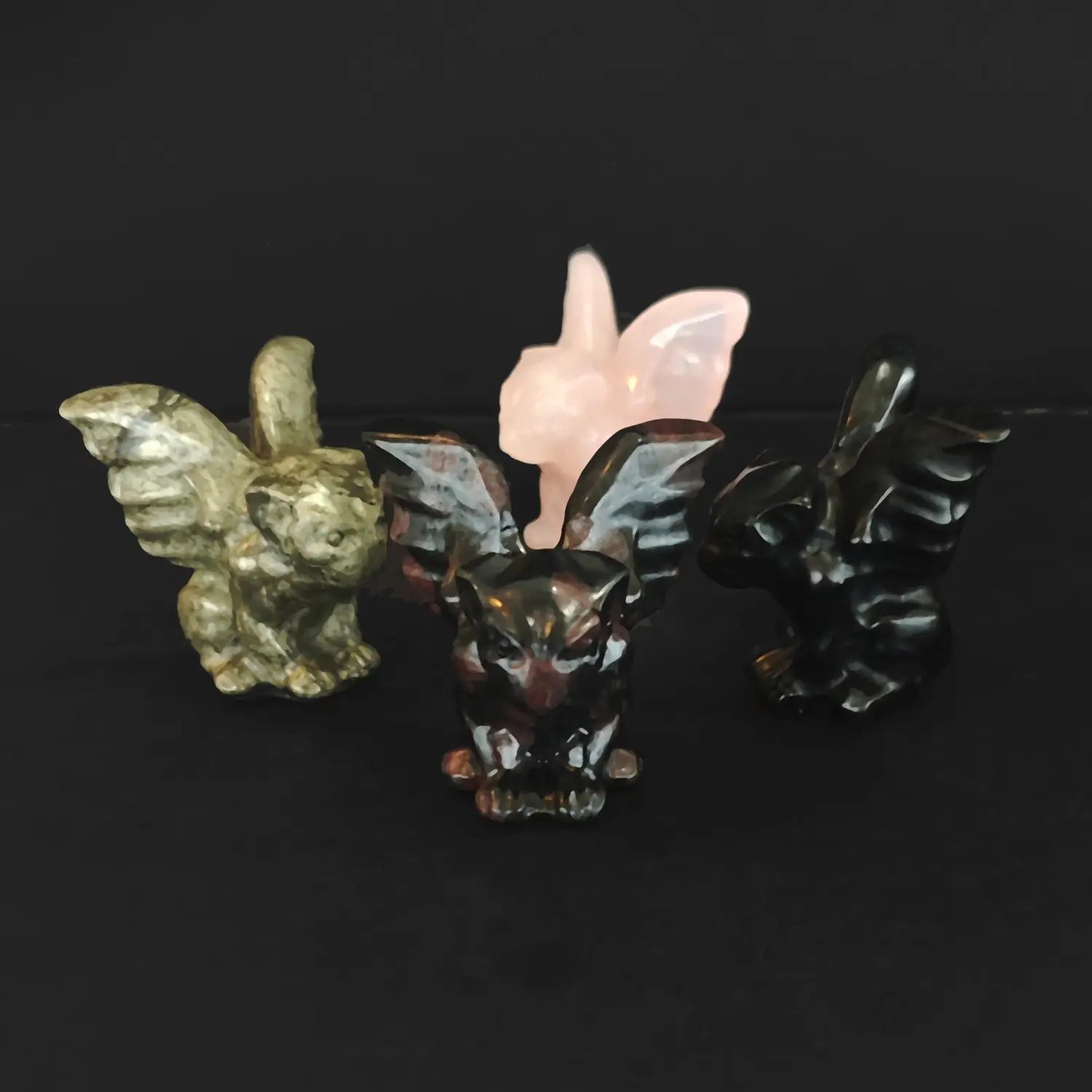 Wholesale natural crystal gargoyle statues carved from pyrite black obsidian red spotted stone and rose quartz