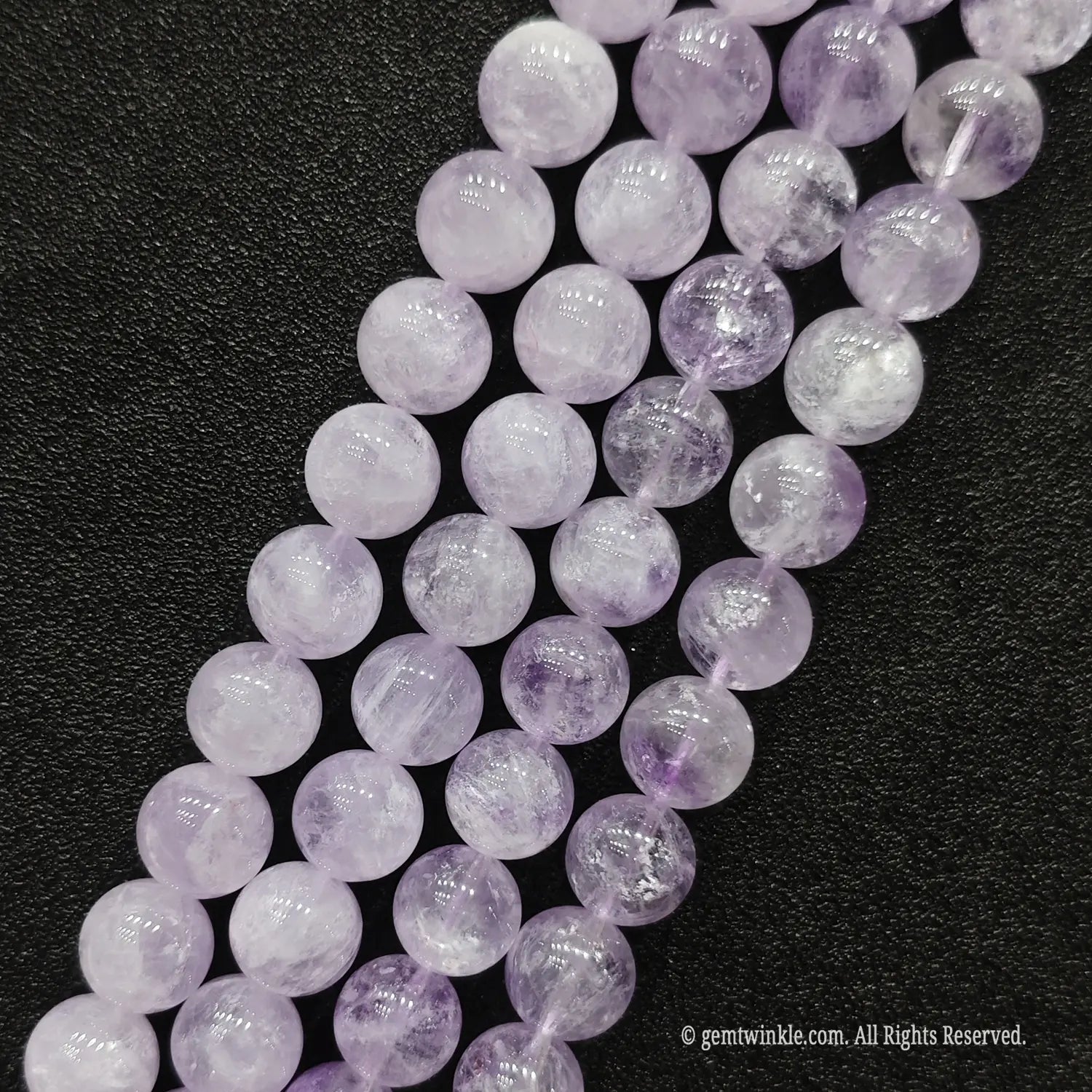 Diagonal alignment of wholesale pale violet lavender amethyst quartz round beads for summer jewelry lines