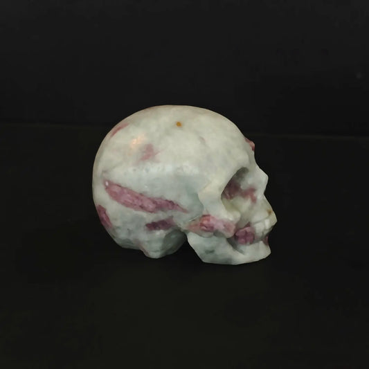 Two natural pink tourmaline in quartz human crystal skull carvings with gothic details as shown in image_293c09.jpg
