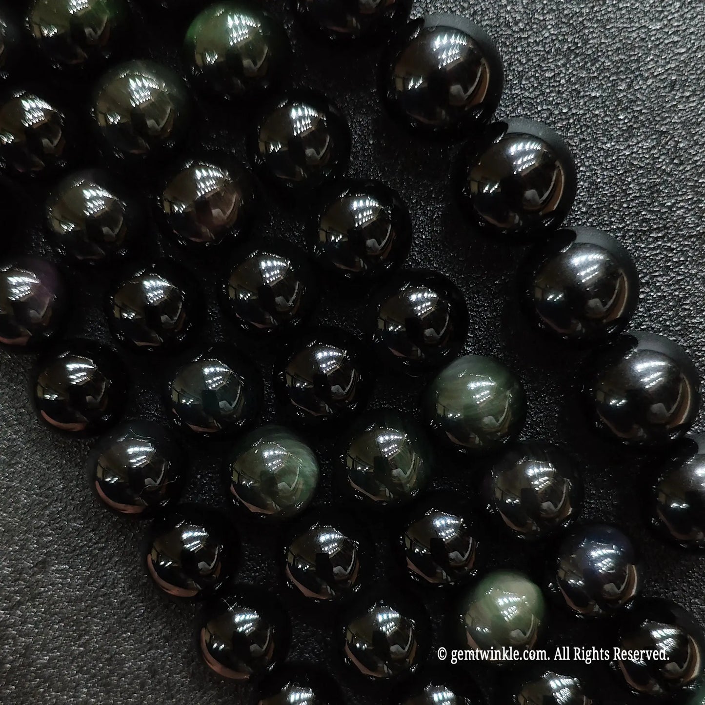 A grid collection of natural rainbow obsidian crystal beads strands from 4mm to 18mm for custom jewelry making