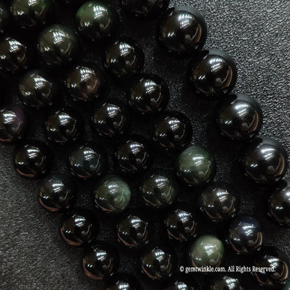 A grid collection of natural rainbow obsidian crystal beads strands from 4mm to 18mm for custom jewelry making