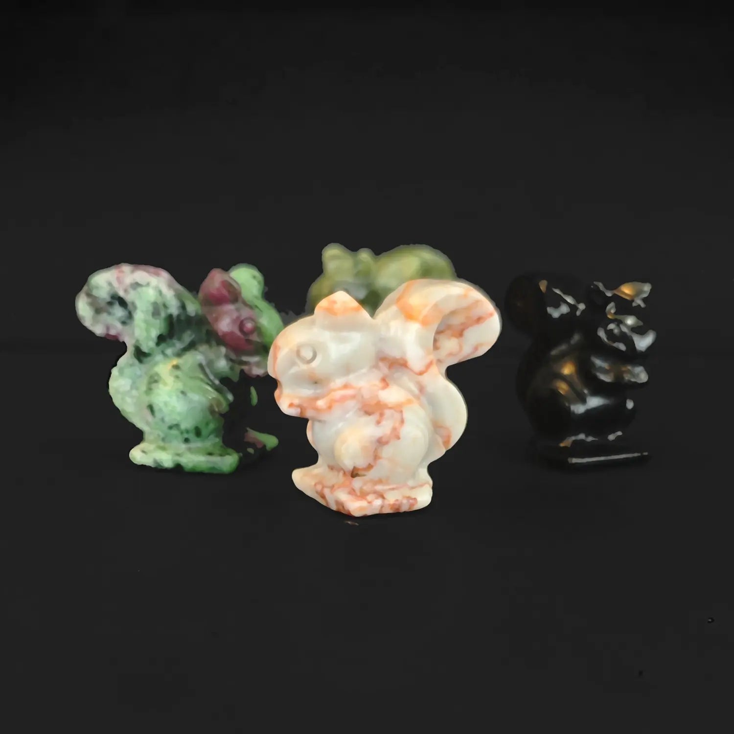 Wholesale natural crystal squirrel statues carved from red green stone serpentine red banded stone and black obsidian